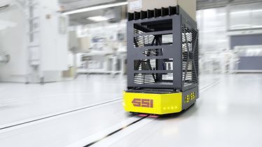 Automated guided vehicle WEASEL® with carton as load carrier