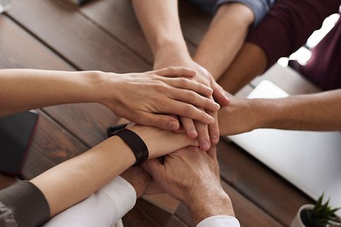 Group of office workers together in a conference room